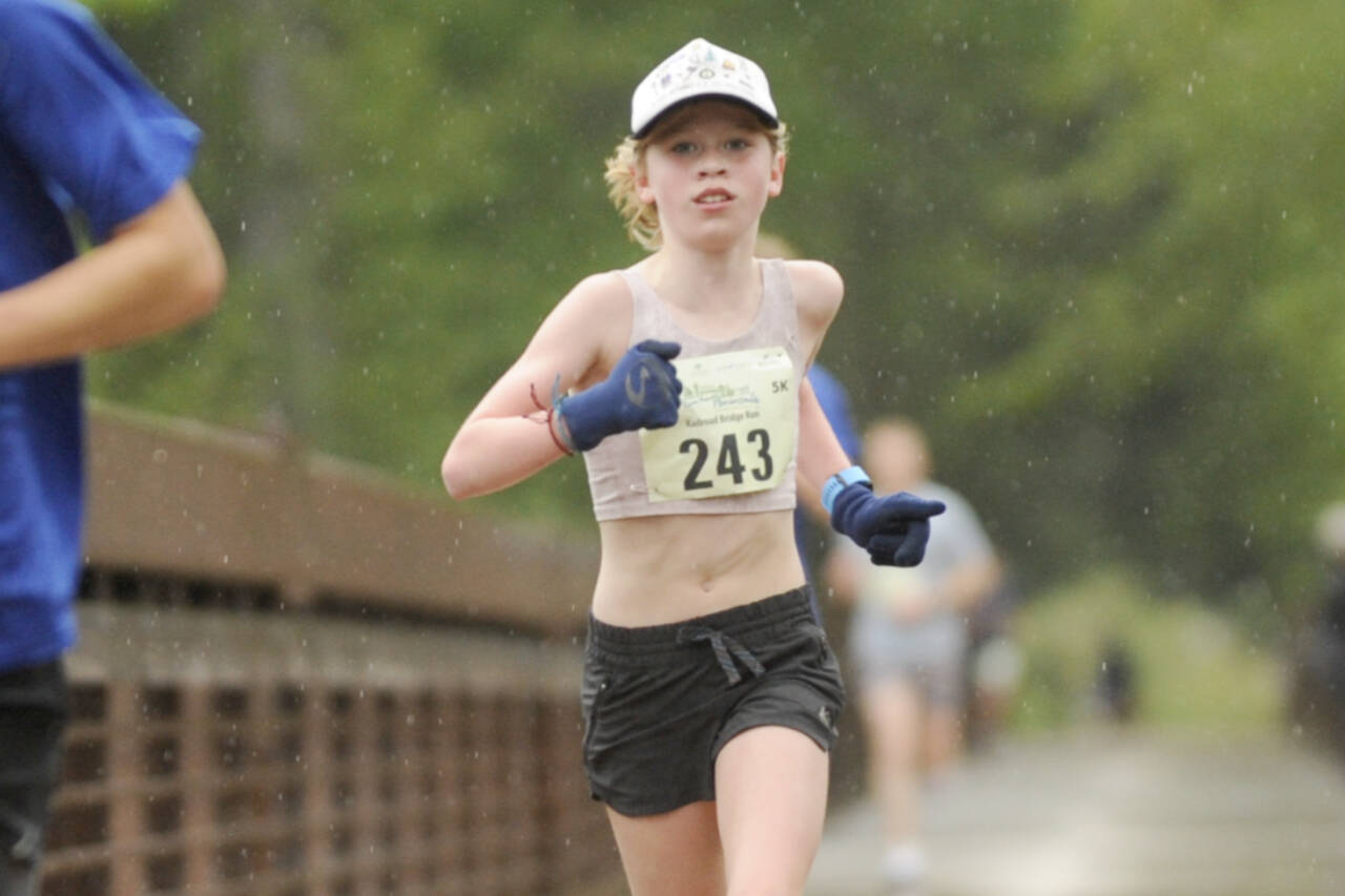 Eleanor Jones, 11, of Sequim wins the Sequim Railroad Run Saturday, taking first among the women in the 5K by two minutes. It was not her first Run the Peninsula first-place medal. (Michael Dashiell/Olympic Peninsula News Group)