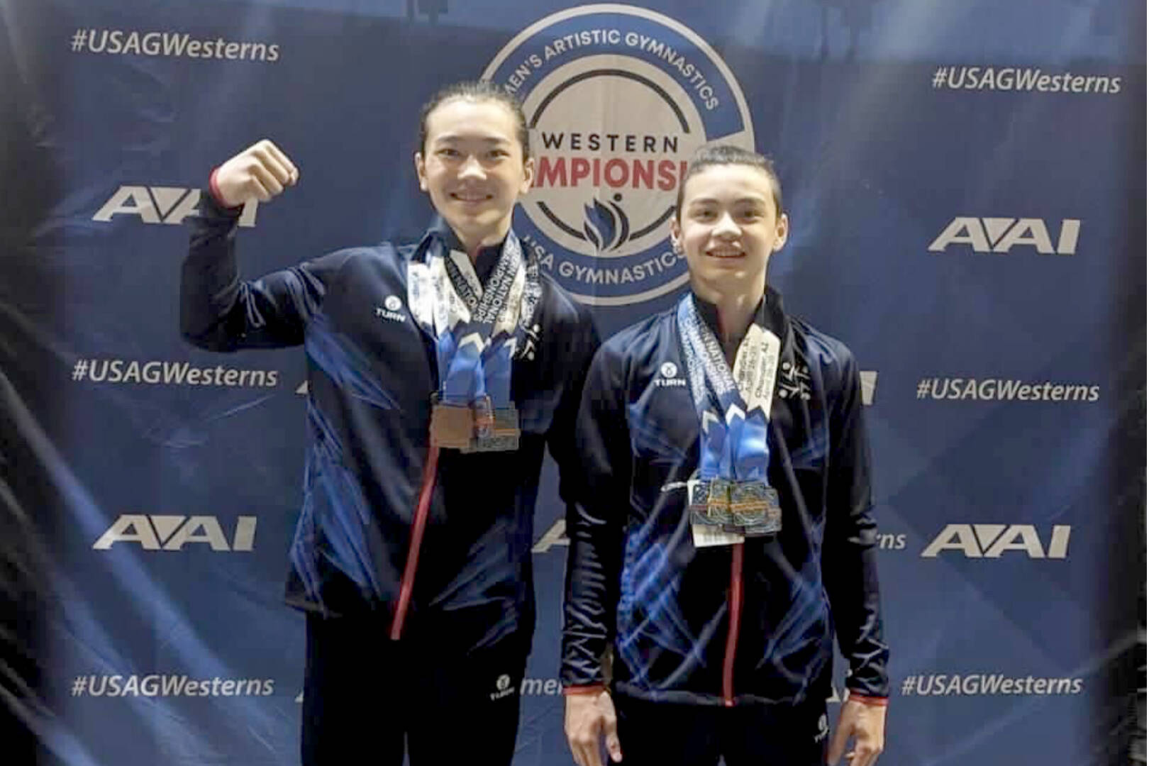 Conor and Liam DeWolf of Port Angeles celebrate their second- and fourth-place all around medals from the 2024 Men’s Western National Championship late last week in Chandler, Ariz. (Klahhane Gymnastics)