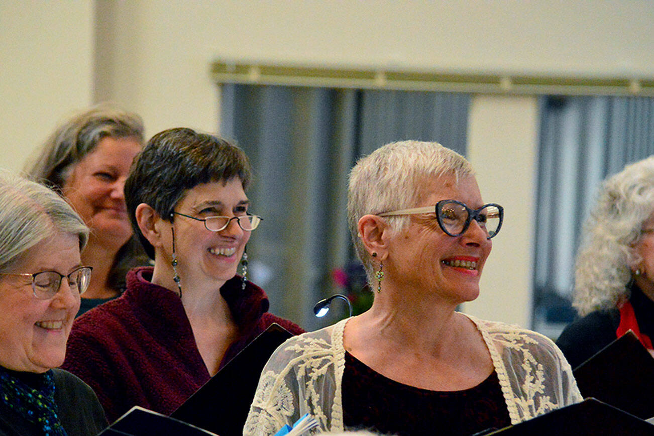 Sopranos rehearsing the Brahms Requiem are, from left, MarySue French of Port Angeles, Elizabeth Bindschadler of Quilcene, and Kelly Sanderbeck and Susan Roe of Port Angeles. (Diane Urbani de la Paz/For Peninsula Daily News)