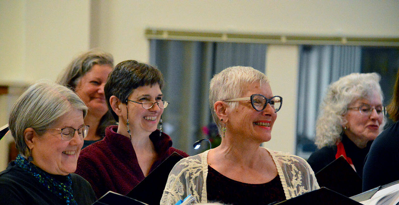 Sopranos rehearsing the Brahms Requiem are, from left, MarySue French of Port Angeles, Elizabeth Bindschadler of Quilcene, and Kelly Sanderbeck and Susan Roe of Port Angeles. (Diane Urbani de la Paz/For Peninsula Daily News)