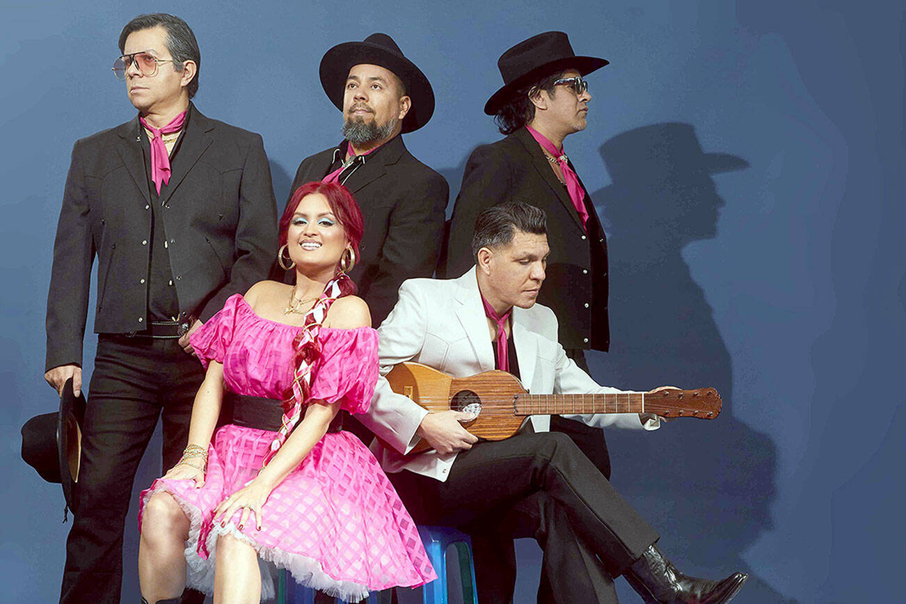 Hector Flores, seated at right, and his band Las Cafeteras are coming to Field Arts & Events Hall on Saturday night. photo by Yulissa Mendoza