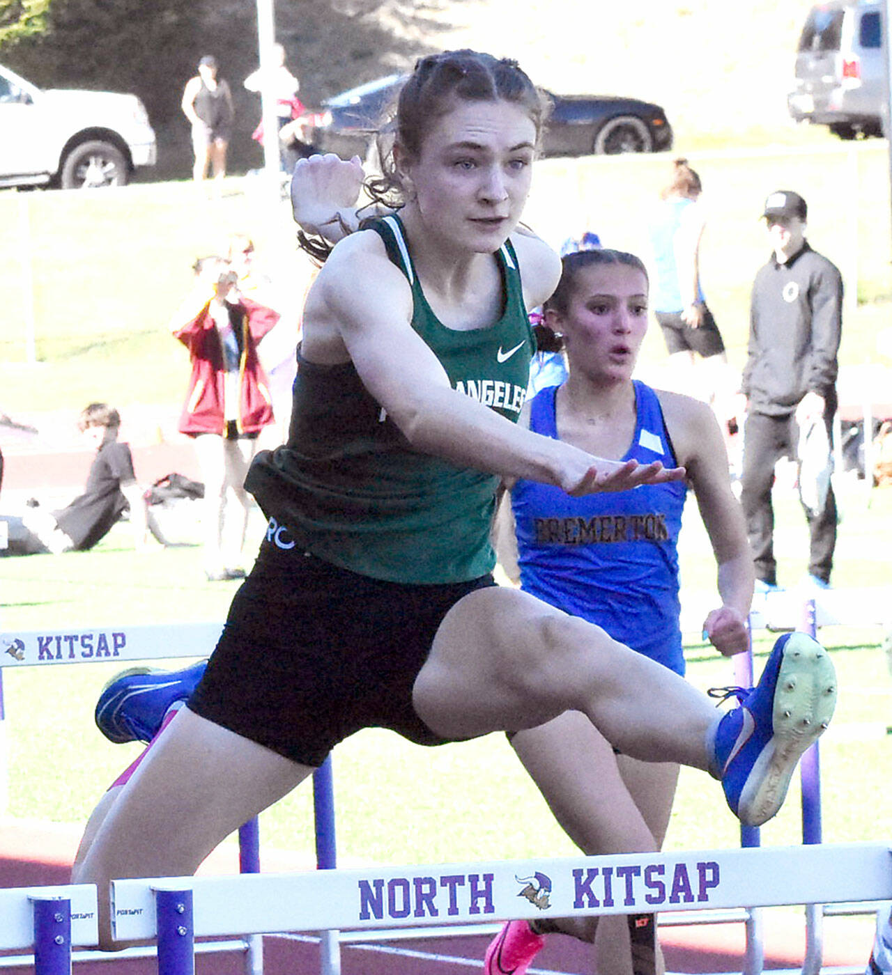 Nicholas Zellar-Singh/Kitsap News Group Port Angeles’ Faerin Tait leaps during the 100-meter hurdles Thursday at the Olympic League Track and Field Championship at North Kitsap High School.