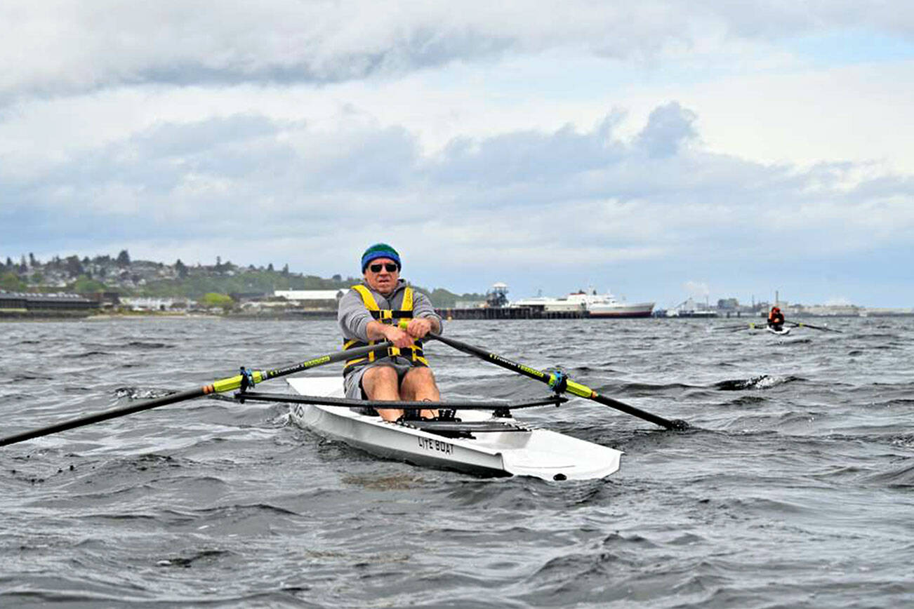 Olympic Peninsula Rowing Association
La Push's James Lesniak makes his way upwind on Port Angeles Harbor during the first Edizgigantus Coastal Rowing Regatta with the MV Coho ferry and Red Lion Hotel in the background.