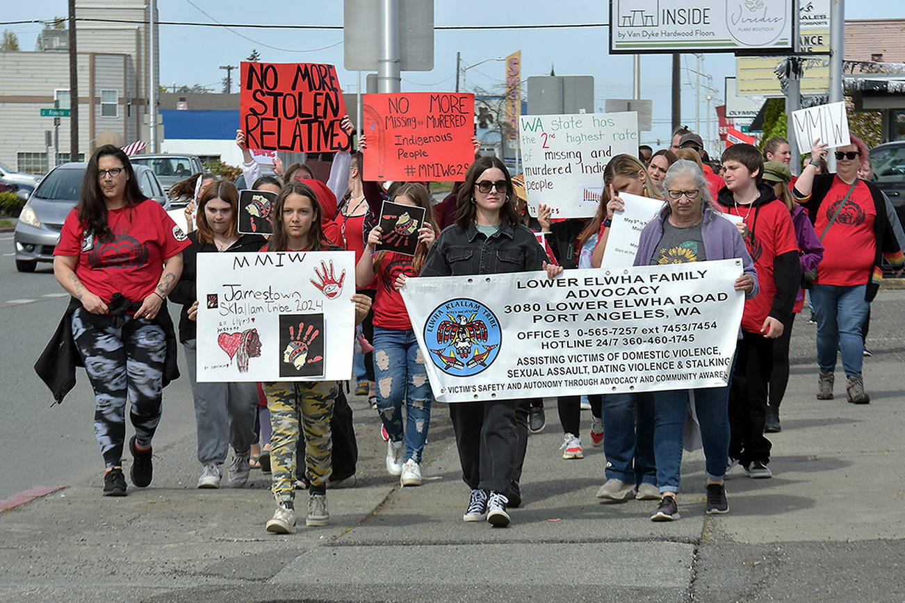 Participants in Friday's Missing and Murdered Indigenous People Walk make their way along First Street in Port Angeles on their way from the Lower Elwha Klallam Heritage Center to Port Angeles Civic Field. (Keith Thorpe/Peninsula Daily News)