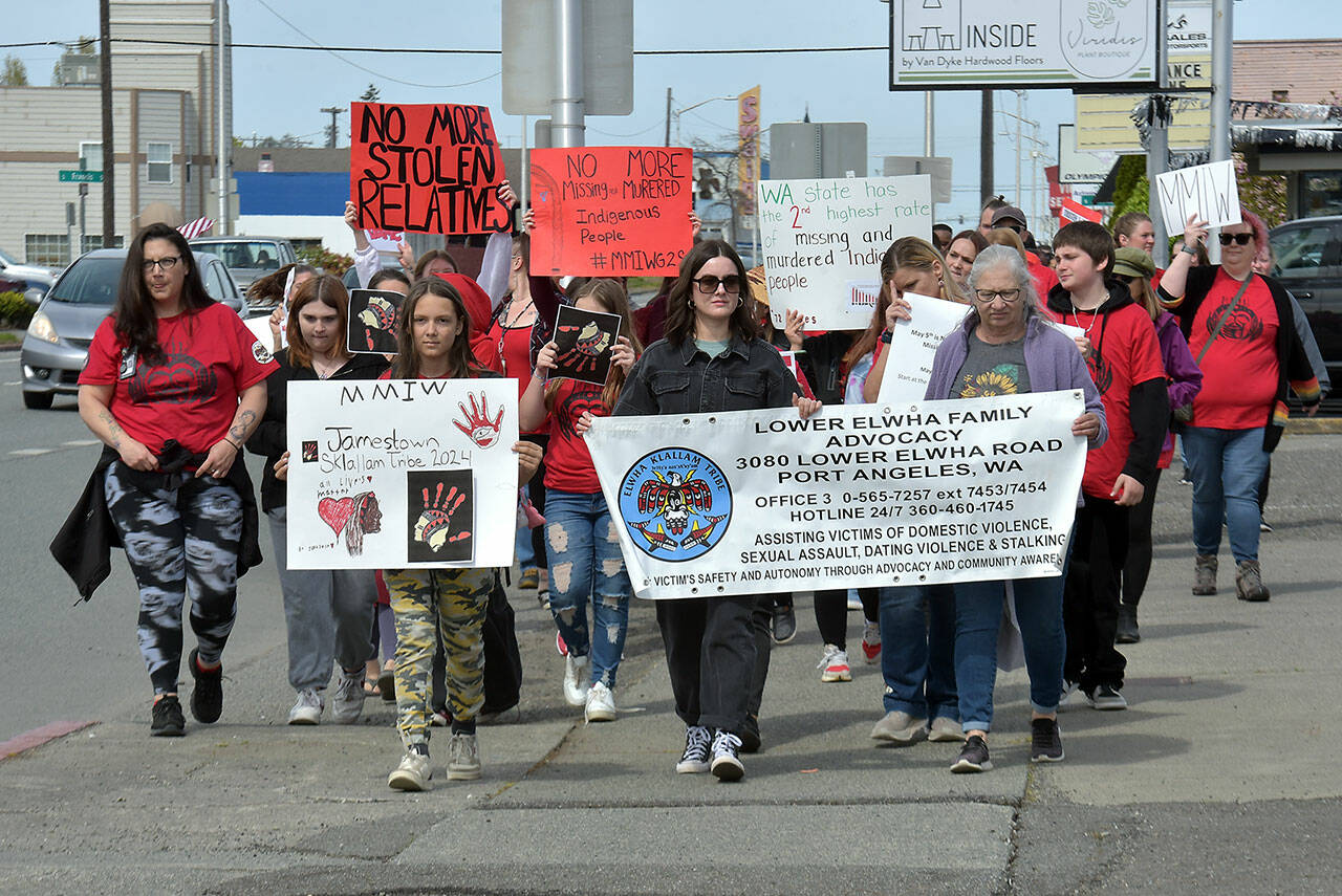 Participants in Friday’s Missing and Murdered Indigenous People Walk make their way along First Street in Port Angeles on their way from the Lower Elwha Klallam Heritage Center to Port Angeles Civic Field. (KEITH THORPE/PENINSULA DAILY NEWS)