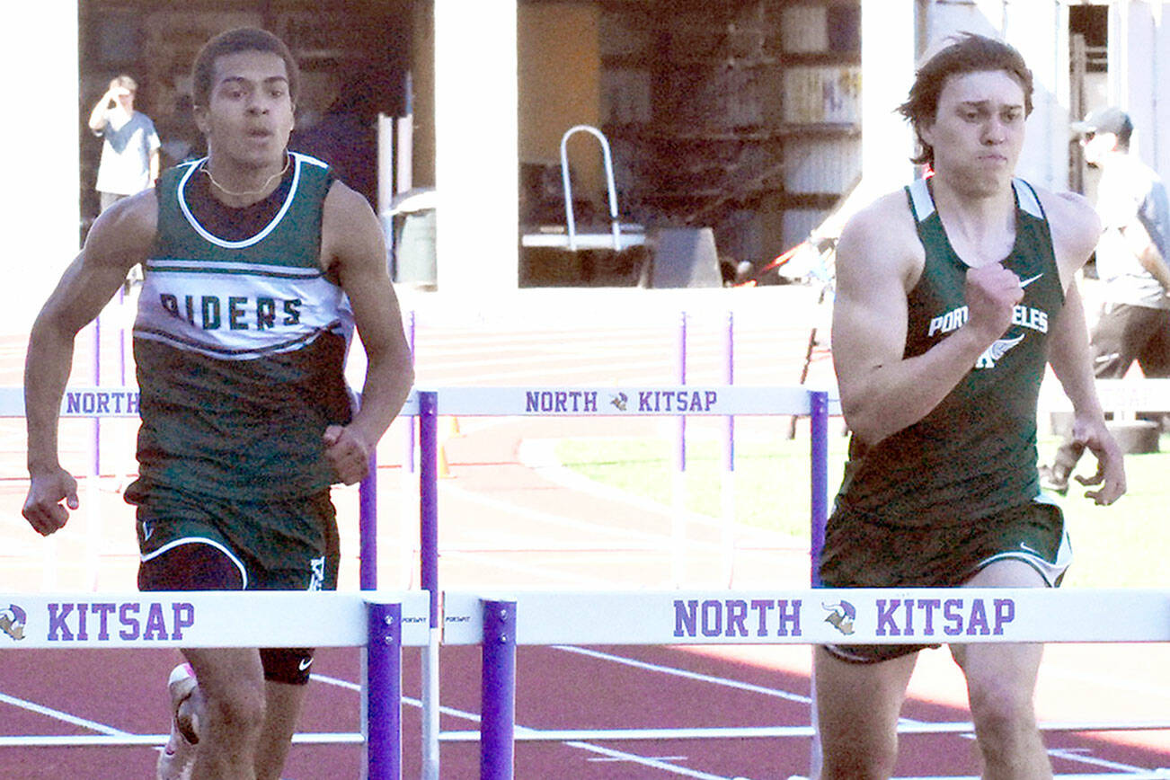 Nicholas Zellar-Singh/Kitsap News Group
Port Angeles' Donovan Heins, left, and Parker Nickerson run in the 110-meter hurdles Thursday at the Olympic League Track and Field Championship at North Kitsap High School. Nickerson won both the 100 and the 300 hurdles while Heins won the long jump Saturday with the No. 1 distance in the entire state.