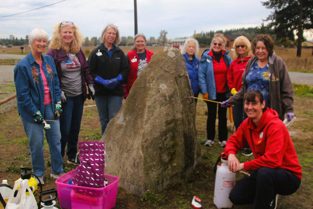 Volunteers from the Michael Trebert Chapter of the Daughters of the American Revolution prepare in October 2023 to clean the stone for a World War I monument in Carlsborg. The group looks to restore the stone this year. Pictured, from left, are Wanda Bean, Judy Nordstrom, Ginny Wagner, Mona Kinder, Darlene Cook, Kristine Konopaski, Pam Grider, Sharlyn Tompkins and Amira-Lee Salavati. Participants not pictured include Judy Tordini and Lindsey Christianson. (Michael Trebert Chapter/Daughters of the American Revolution)