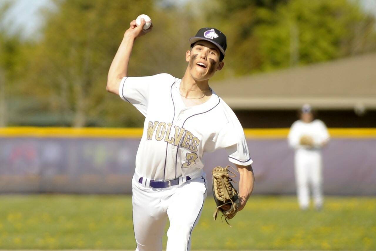 Michael Dashiell/Olympic Peninsula News Group
Sequim's Ethan Staples, shown here pitching during a win over Kingston last month, struck out seven and drove in two runs in the Wolves' 7-3 bi-district tournament win over Fife on Wednesday.