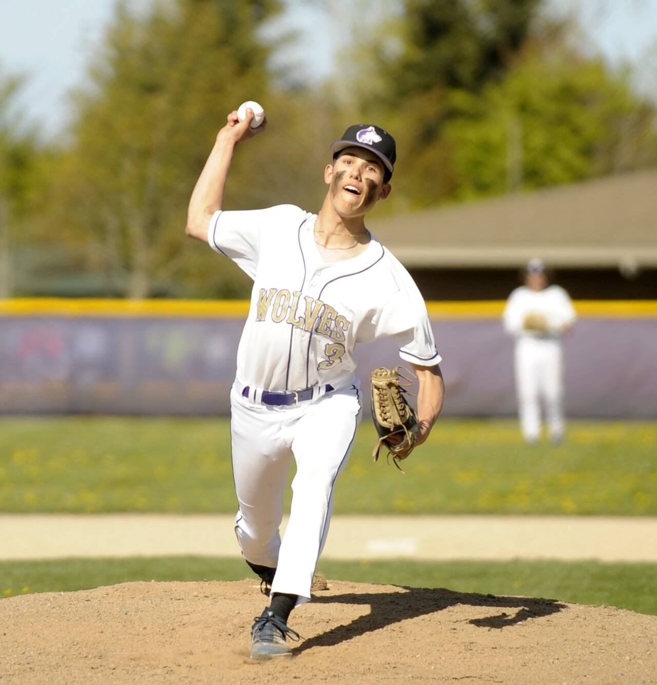 Michael Dashiell/Olympic Peninsula News Group Sequim’s Ethan Staples, shown here pitching during a win over Kingston last month, struck out seven and drove in two runs in the Wolves’ 7-3 bi-district tournament win over Fife on Wednesday.