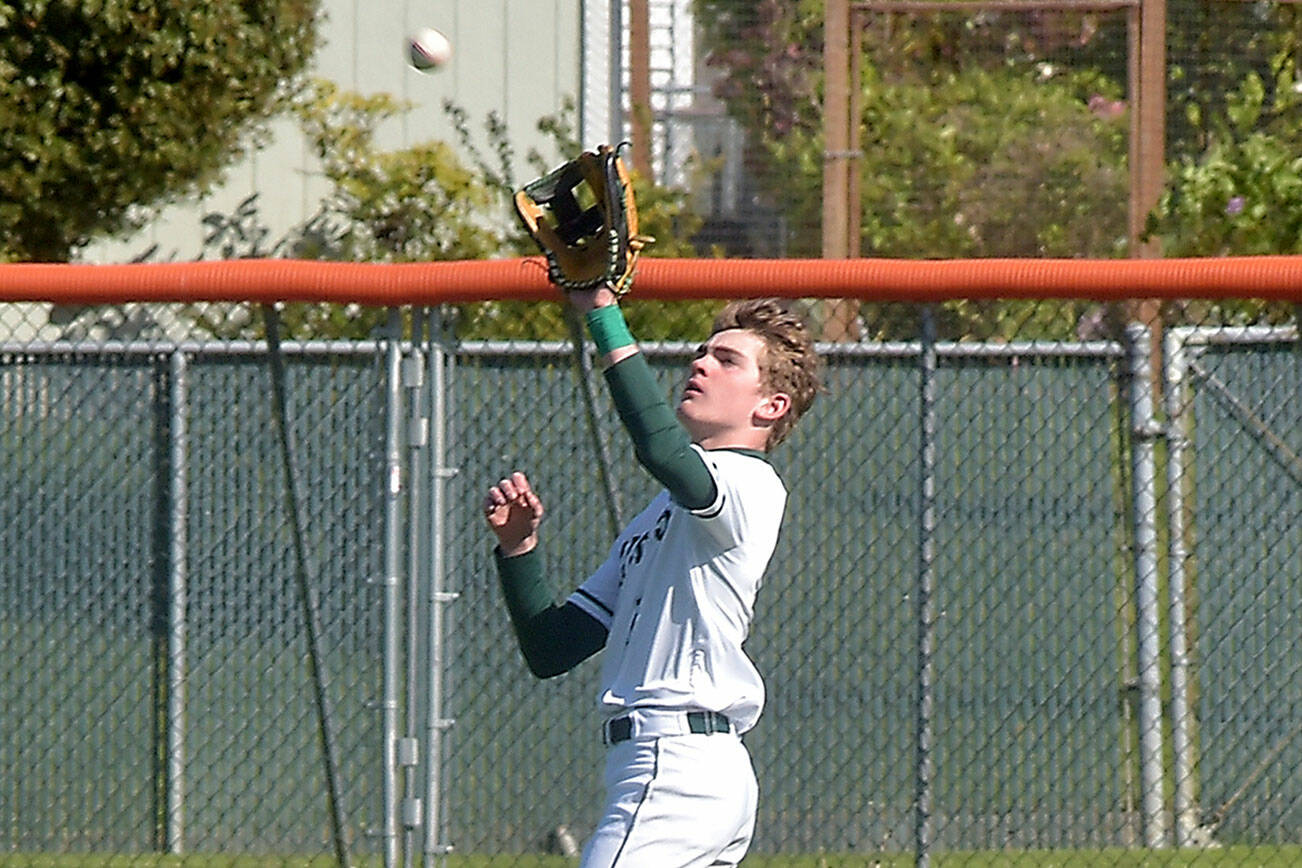 KEITH THORPE/PENINSULA DAILY NEWS
Port Angeles centerfielder Nathan Basden catches a high popup during Tuesday's playoff against Fife in Port Angeles.