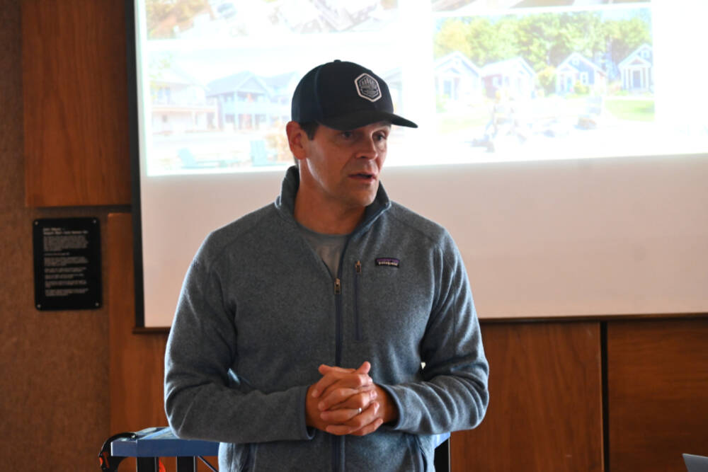 Seabrook CEO Casey Roloff talks with community members about a planned 500- to 600-home development near Sequim Bay on April 23 at John Wayne Marina. (Michael Dashiell/Olympic Peninsula News Group)