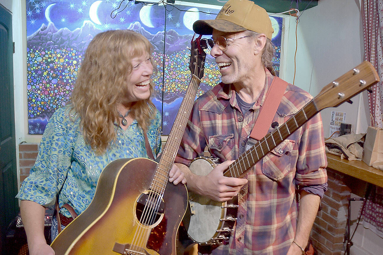 Kim Trenerry, left, and Jason Mogi, who make up the Port Angeles-based duo Deadwood Revival, shown Tuesday at the New Moon Craft Tavern in Port Angeles, will perform at this weekend’s Juan de Fuca Festival of the Arts. (Keith Thorpe/Peninsula Daily News)
