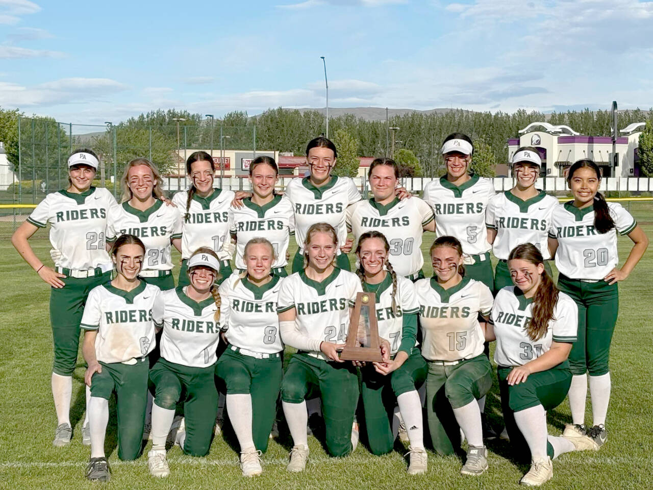 The Port Angeles softball team celebrates its fourth-place finish at 2A state tournament Saturday. The Roughriders won three out of five games at state to place and they only graduate two seniors. (Port Angeles softball)