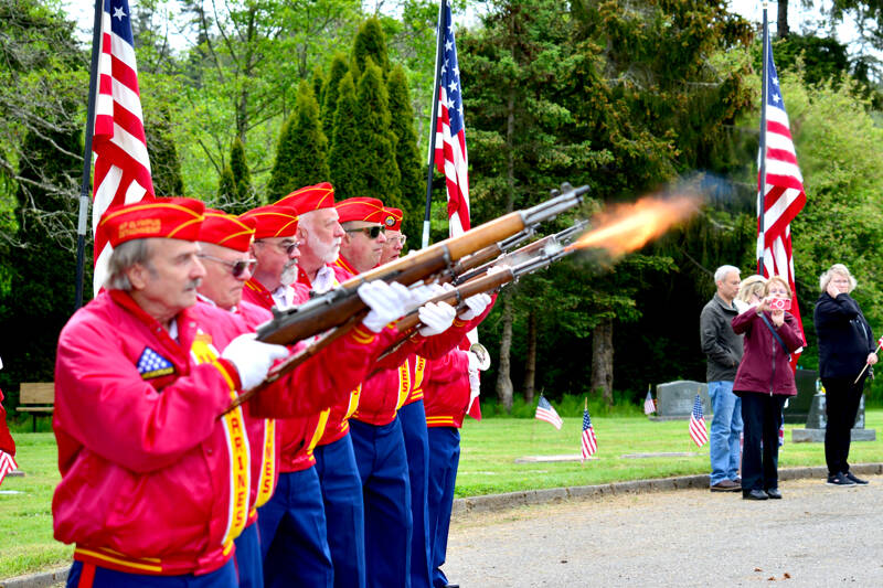 Members of the Mount Olympus Detachment 897 of the Marine Corps League give a 21-gun salute at a Memorial Day ceremony at Mt. Angeles Memorial Park in Port Angeles on Monday. The ceremony was hosted by the Veterans of Foreign Wars Post 6787 of Carlsborg and was one of many Memorial Day events held in Clallam and Jefferson counties. (Peter Segall/Peninsula Daily News)