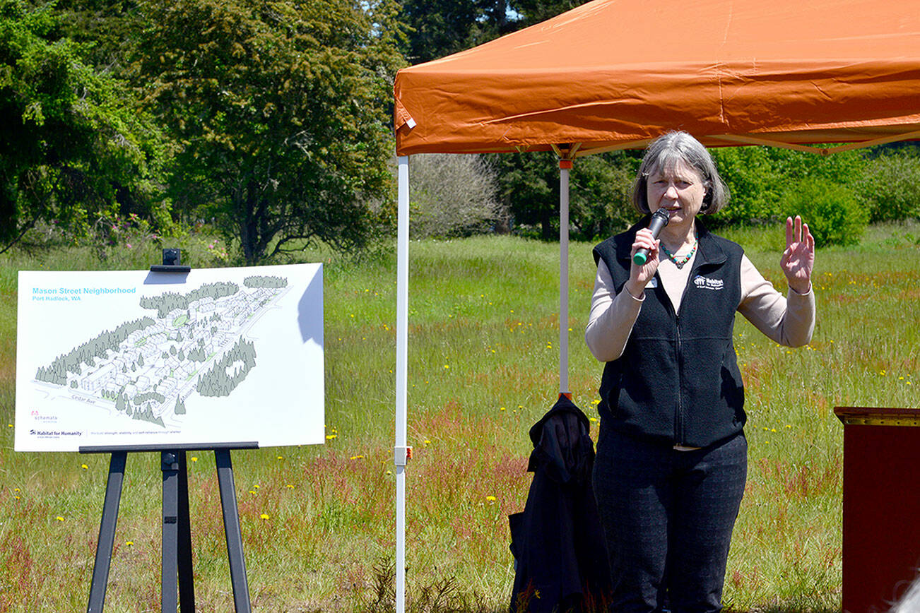 Habitat for Humanity of East Jefferson County Executive Director Jamie Maciejewski speaks to a crowd of more than 50 people at the future site of Habitat's affordable housing development in Port Hadlock on Thursday. Habitat hopes to build at least 150 permanently affordable homes at the site, known as the Mason Street project, and on Thursday community members were invited to Port Hadlock to celebrate the next phase of the development. (Peter Segall / Peninsula Daily News)