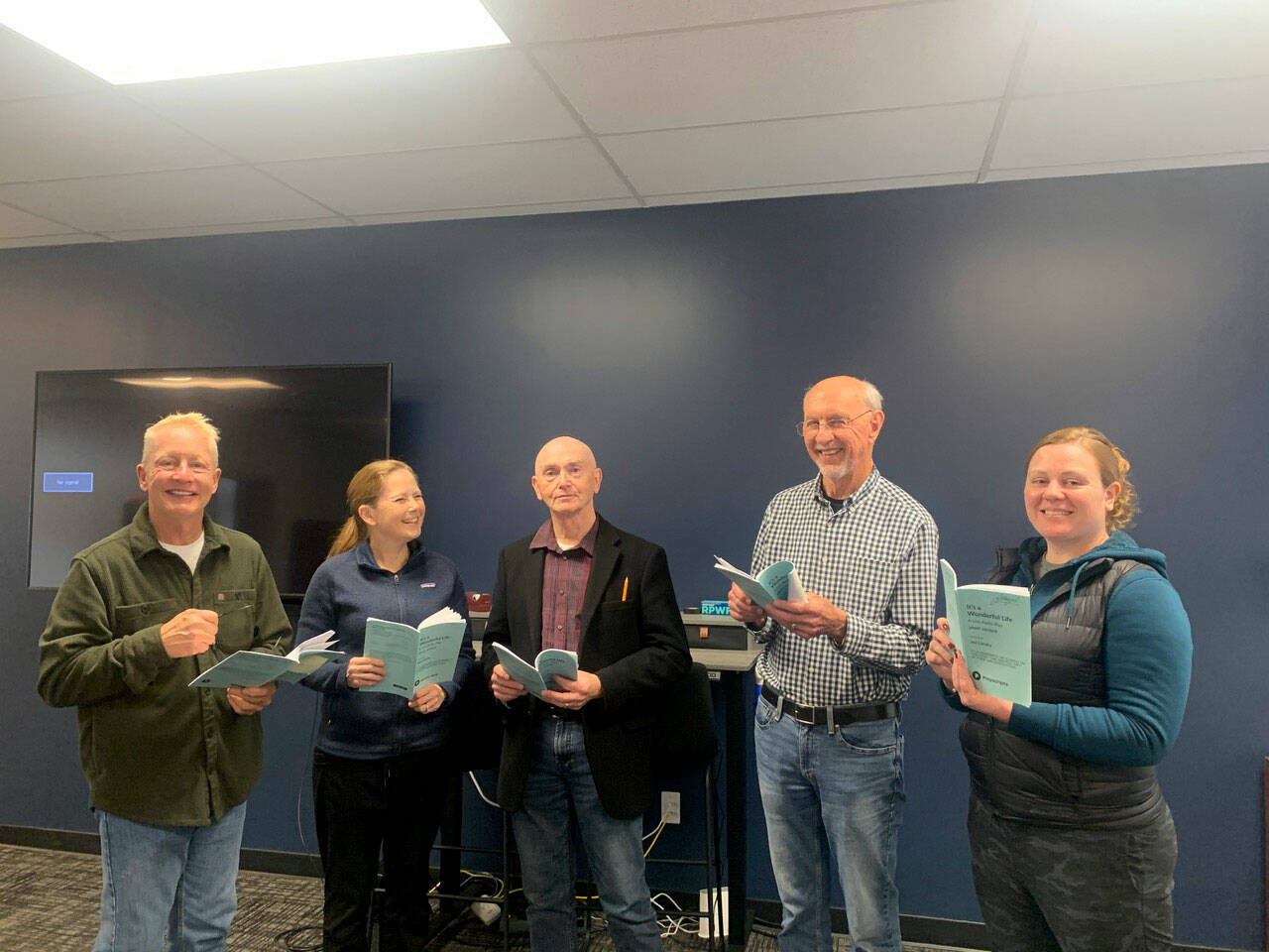 Cast members, from left, Stephen Browning, Christie Lang, Glenn Gilbert, Jim Gormly and Kelly McNees rehearse for the Port Ludlow Players production of Its a Wonderful Life: A Live Radio Play.
