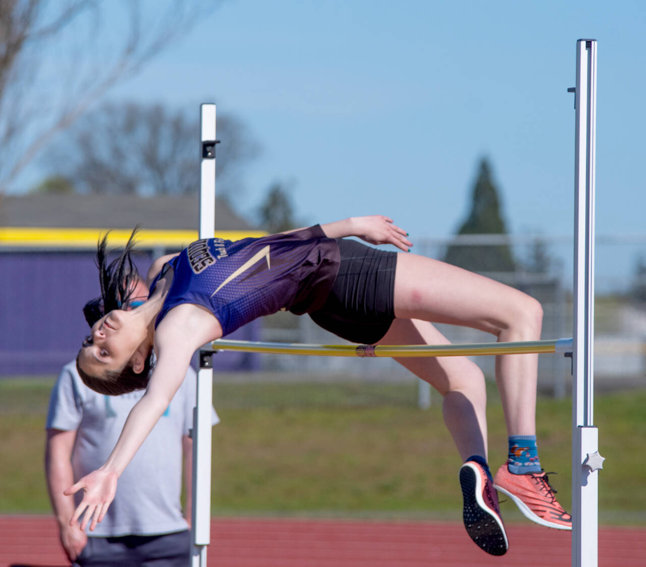 Sequim's Clare Turella competes in the high jump in Thursday's meet in Sequim. (Emily Mathiessen/Olympic Peninsula News Group)