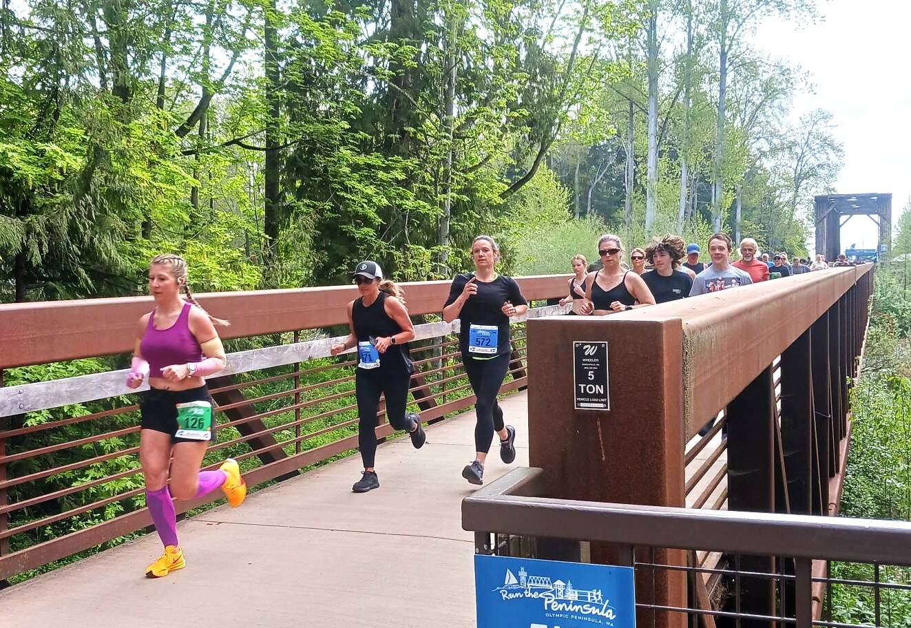 Melinda Roark (126) leads the pack at the beginning of the Sequim Railroad Bridge Run 5K and 10K on Saturday. (Pierre LaBossiere/Peninsula Daily News)