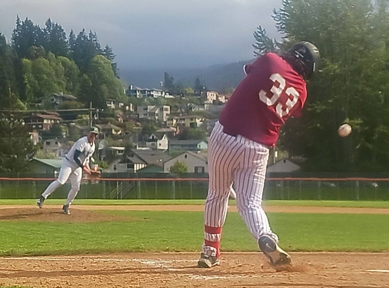 Port Angeles Braedyn Boulden-Davis delivers a pitch fouled off by Kingstons Joel Jones (33) on Wednesday at Civic Field in Port Angeles. The Roughriders won the regular season finale 7-6 in nine innings, overcoming some gusty weather conditions. (Pierre LaBossiere/Peninsula Daily News)