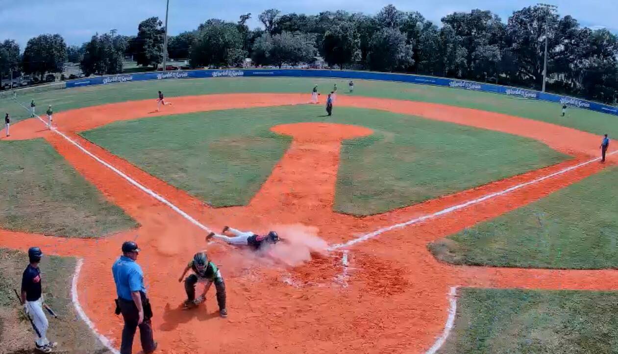 Wilder Seniors Colton Romero slides home after coming all the way around from first base on a Braydan White triple at the Babe Ruth 18U World Series in Ocala, Fla., on Saturday. Wilder Senior beat a team from Australia 16-1. (Gamerchanger)