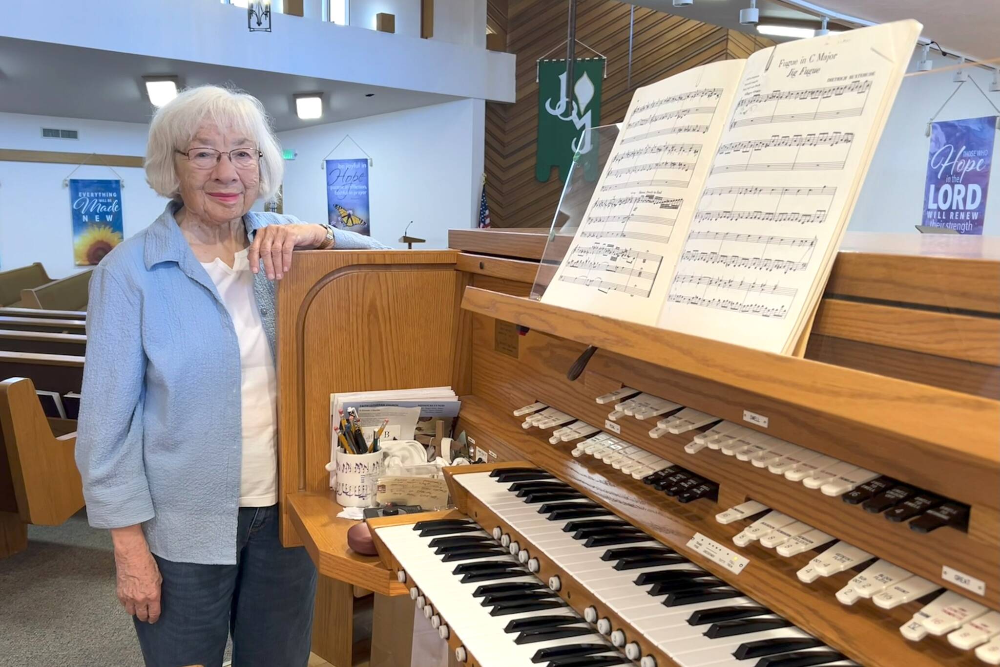 Matthew Nash/Olympic Peninsula News Group
Pat Marcy stands by the organ in Faith Lutheran Church that shes played since it was built in 1991. This summer marks her 50th year leading music at the church, and with her retirement, a new director of parish music started on Aug. 3.