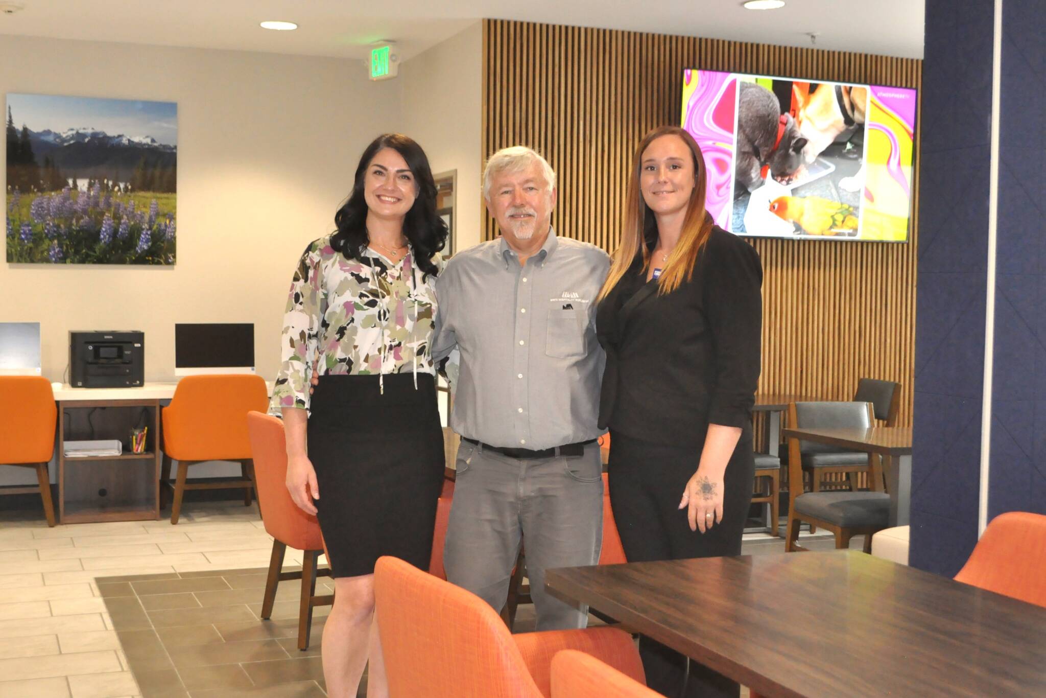 Matthew Nash/Olympic Peninsula News Group
Leaders with Holiday Inn Express & Suites, from left, Namaste Stayton, vice president of hotel operations, Bret Wirta, owner, and Shelby Schleve, general manager, stand in “The Great Room” of the Sequim hotel. It was part of a massive $4 million remodeling project that opened up this space, refreshed hotel rooms and suites and added new amenities throughout the building.