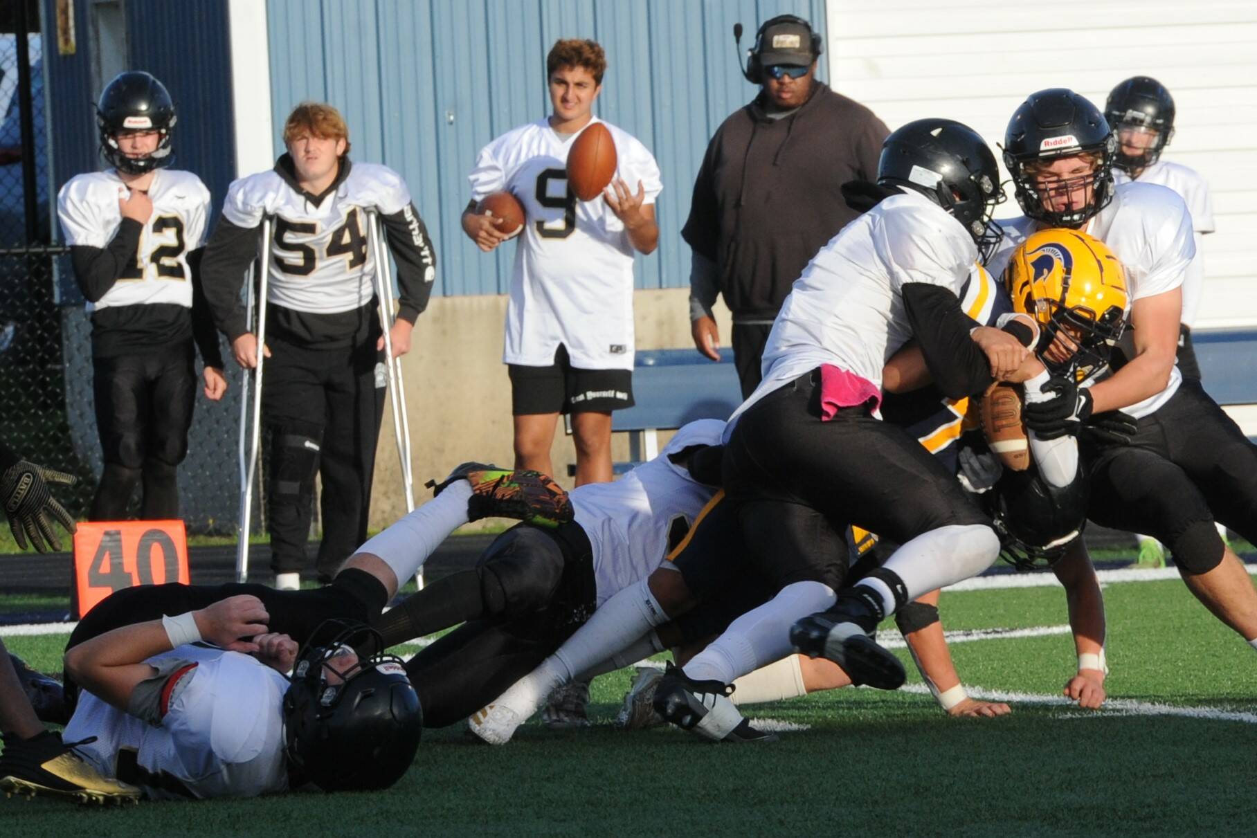 Lonnie Archibald/for Peninsula Daily News Forks’ Estevan Ramos (yellow helmet) is wrapped up by a host of Meridian tacklers during 2024 contest in Forks. Buoyed by offseason training, the Spartans aim is to improve upon a difficult 2024 campaign.
