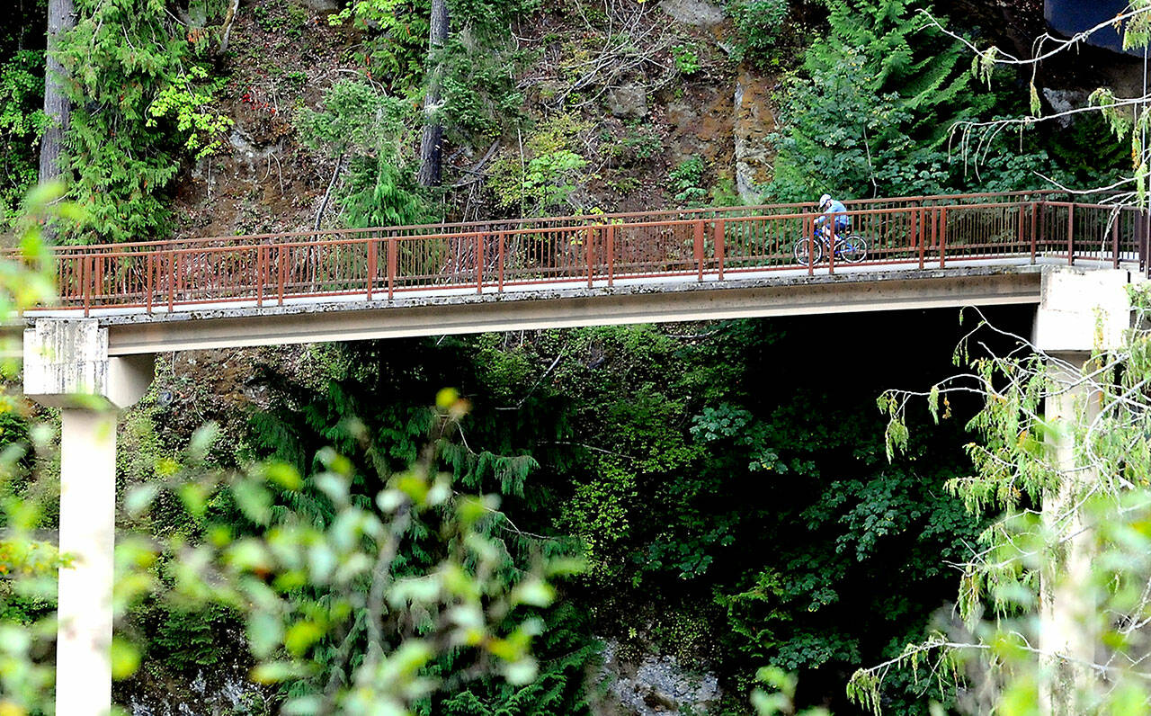 A bicyclist makes his way over an approach span to the pedestrian bridge beneath the Elwha River Bridge west of Port Angeles. The bridges are part of the Olympic Discovery Trail, which, when completed, will stretch from Port Townsend to La Push on the Pacific coast. (Keith Thorpe/Peninsula Daily News)