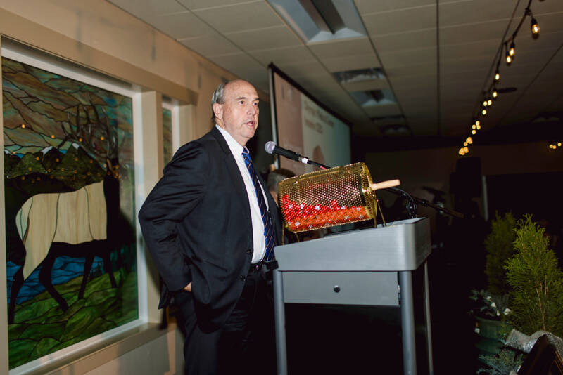 Olympic Medical Center interim CEO Mark Gregson welcomes the audience to the Harvest of Hope event on Saturday at the Guy Cole Event Center in Sequim. (Lexie Winters Photography)