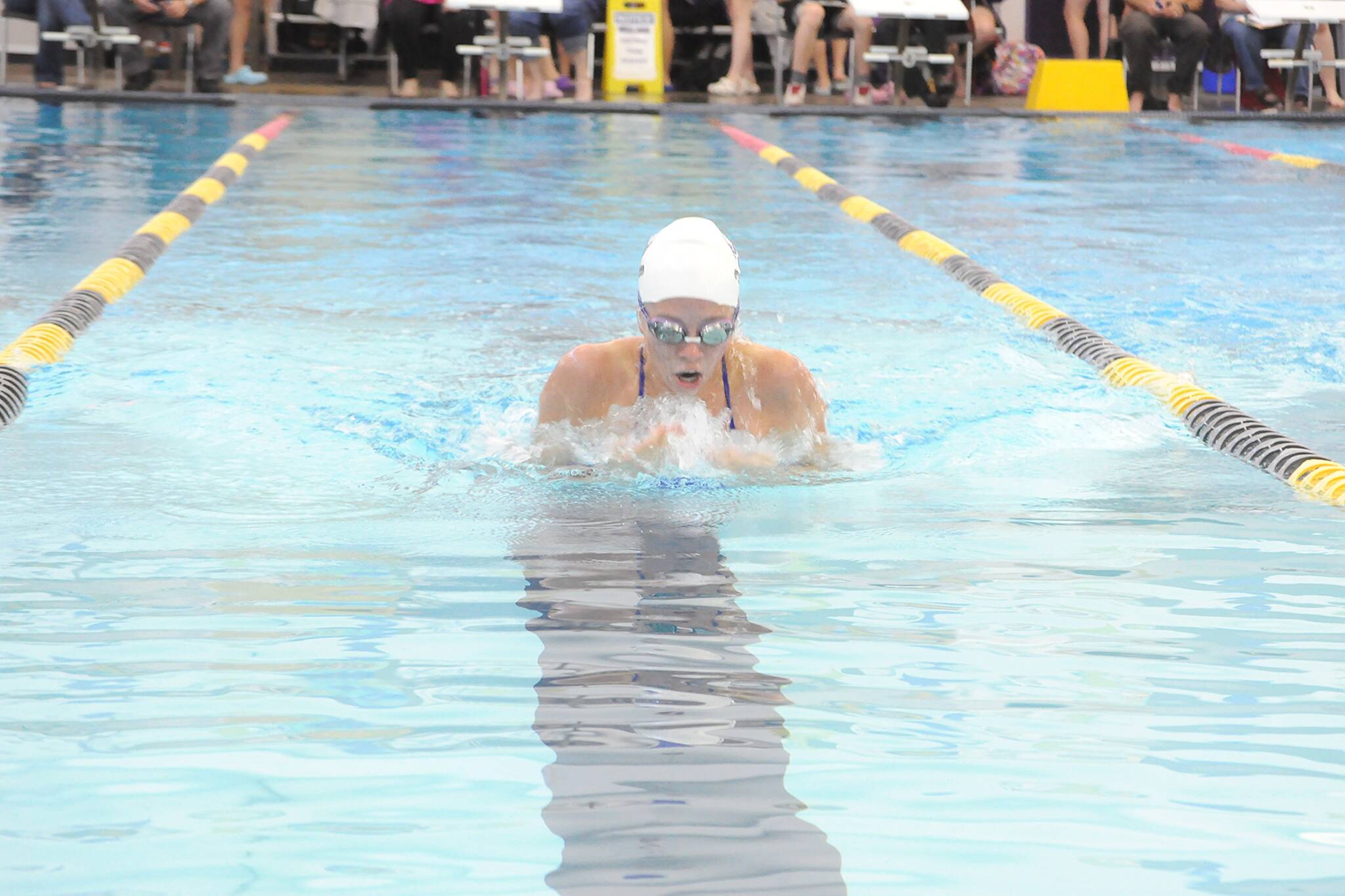 Matthew Nash/Olympic Peninsula News Group 
Sequim’s Annie Ellefson competes in the 100-yard breast stroke during an Olympic League swim & dive meet against North Kitsap at the Sequim YMCA on Wednesday.