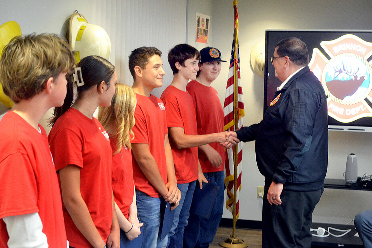 From eft to right, Cadets Emmet Shaw, Madison Boling, Amirrah Woods, Isaac Figueroa, Tyler Matheson and Timmy Manly, along with Brinnon Fire Chief Tim Manly. (Elijah Sussman/Peninsula Daily News)
