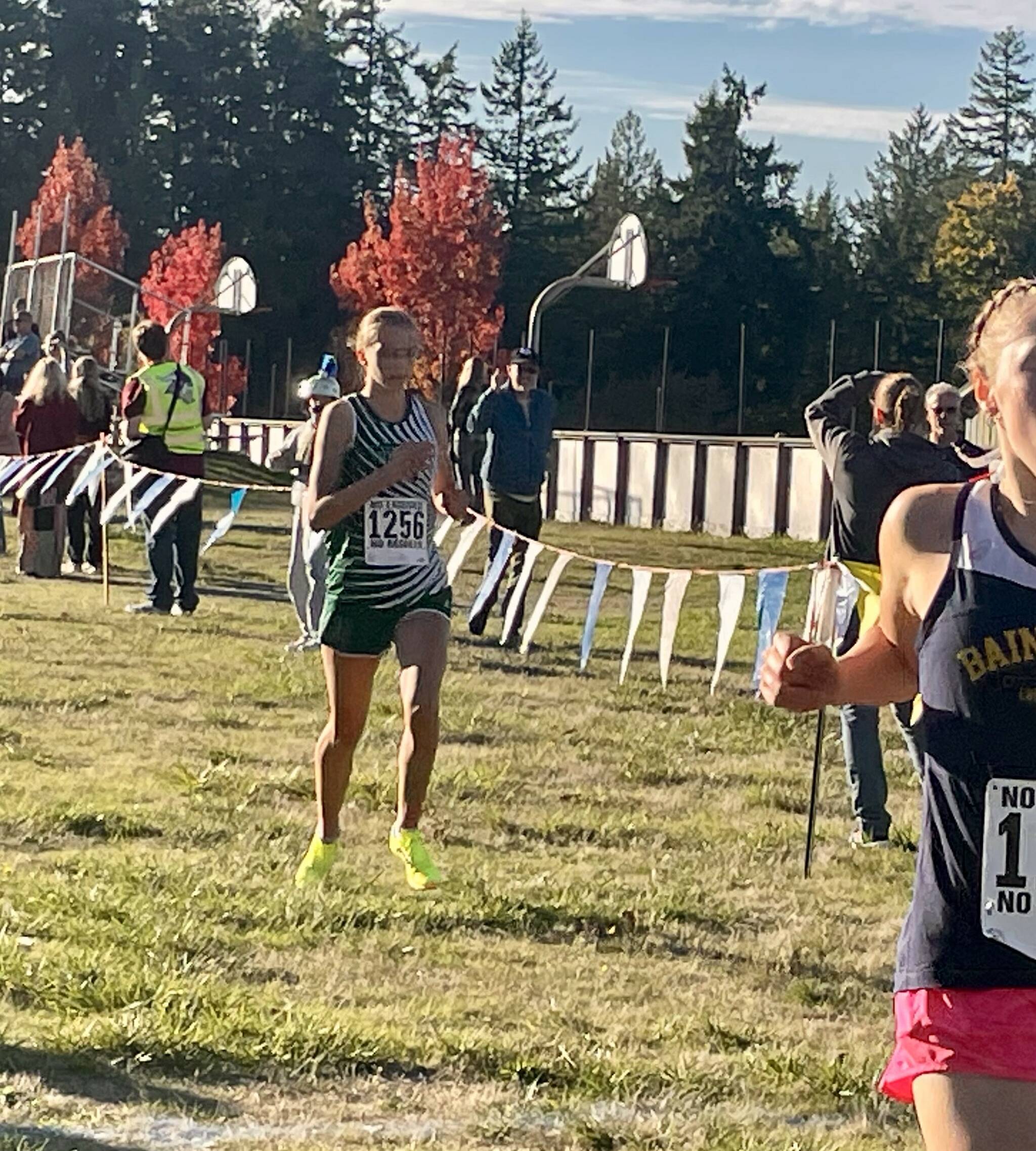 Port Angeles cross country
Port Angeles sophomore Storey Schmidt cut 30 seconds off her previous best time during the fourth Olympic League cross country meet at Battle Point Park on Bainbridge Island.