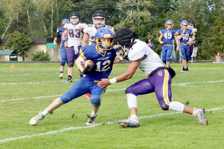 Mikah Love (12), here playing against Quilcene earlier this year, had 429 all-purpose yards against Lake Quinault this weekend. (Dave Logan/for Peninsula Daily News)