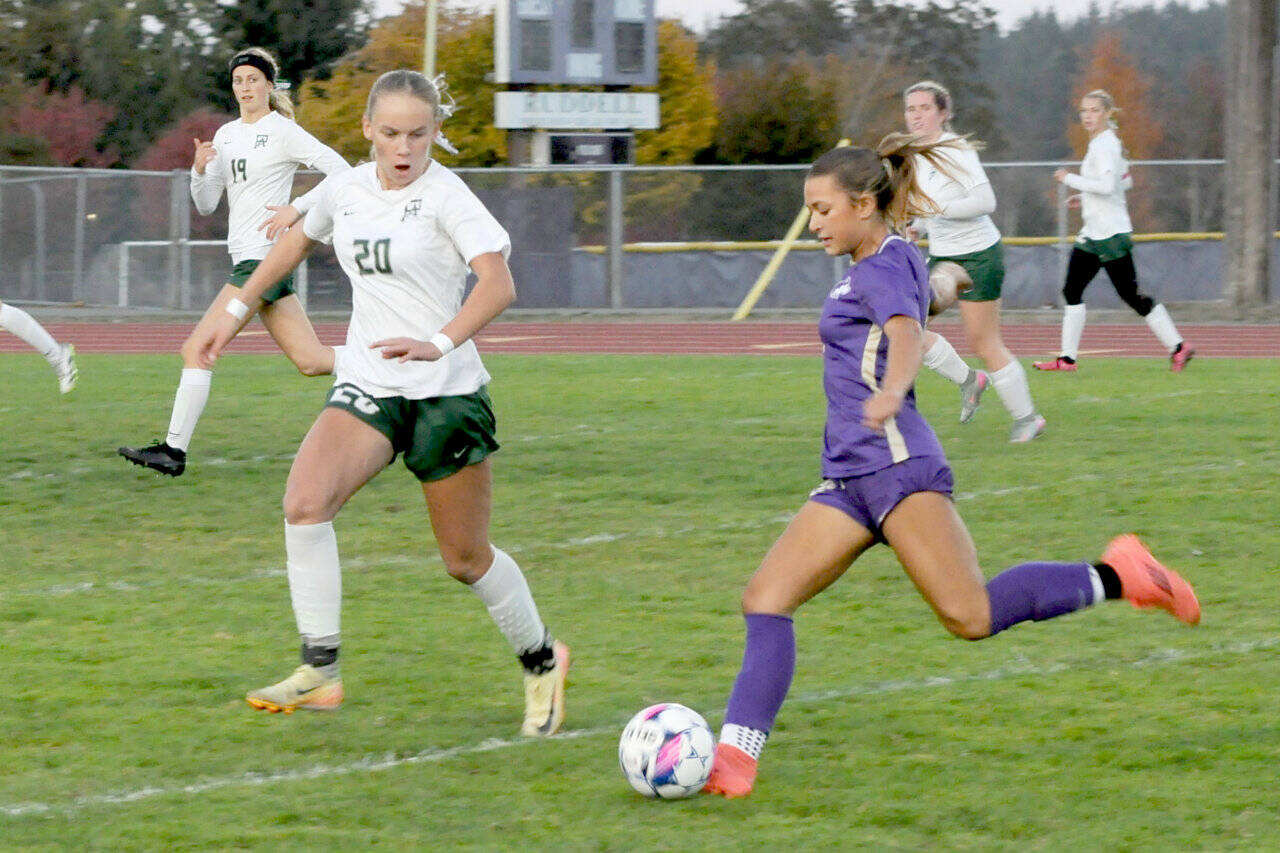 Sequim’s Ruby Moxley-Horgan advances the ball against Port Angeles’ Emma Deshardins (20) on Tuesday in Sequim. The Roughriders scored three goals in the second half to win 3-1. (Matthew Nash/Olympic Peninsula News Group)