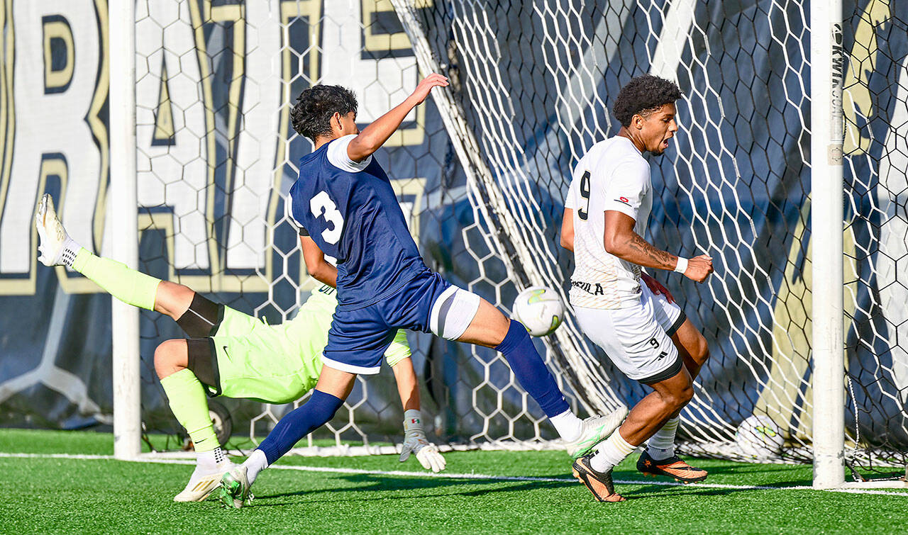 Jay Cline/Peninsula College Athletics Peninsulas Jeremy Obah, right, scores the eventual game-winning goal in the 81st minute of Wednesdays 1-0 win over Bellevue at Wally Sigmar Field. The Pirate men clinched the NWAC North Region title and a first-round playoff bye with the victory.