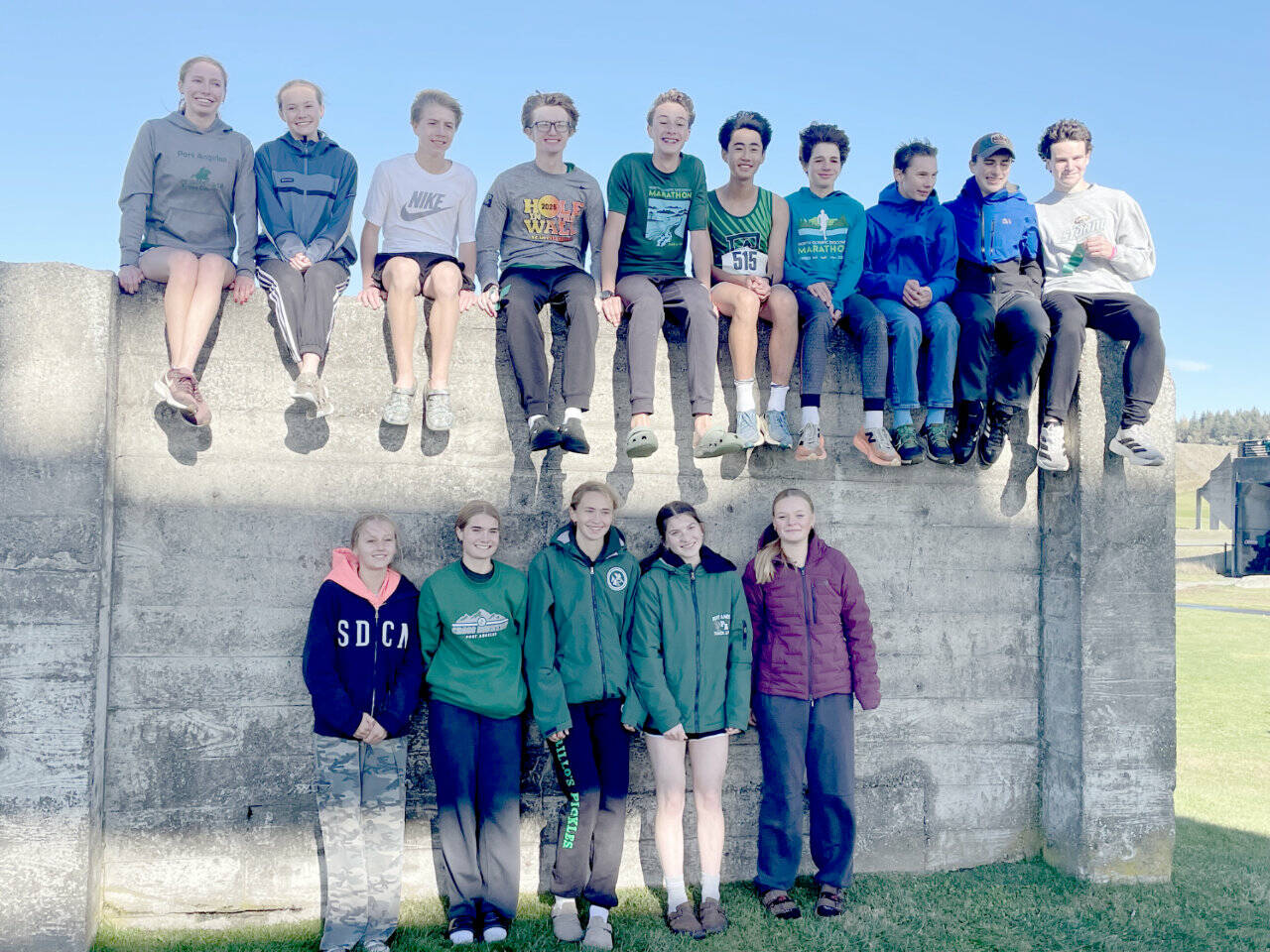 The Port Angeles cross country celebrates during the Westside Classic meet in Tacoma this week. Six members of the team qualified for the state 2A championship, including four boys. (Angie Gooding/Port Angeles Cross Country)