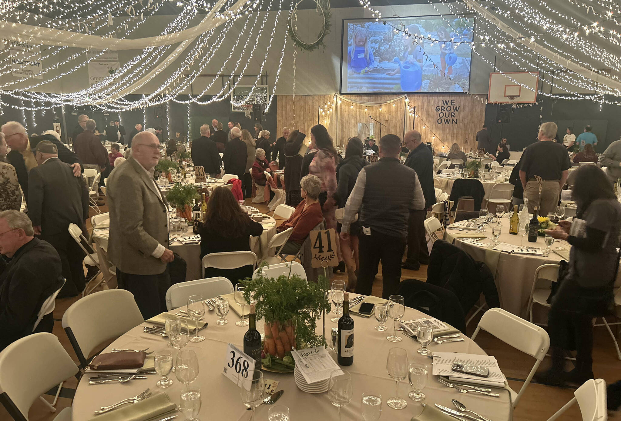 The gym at the Sequim Boys and Girls Club was transformed for the dinner and auction, themed We Grow Our Own, with 400 guests seated among 40 tables, each with 10 place settings. (Kathy Cruz/Olympic Peninsula News Group)