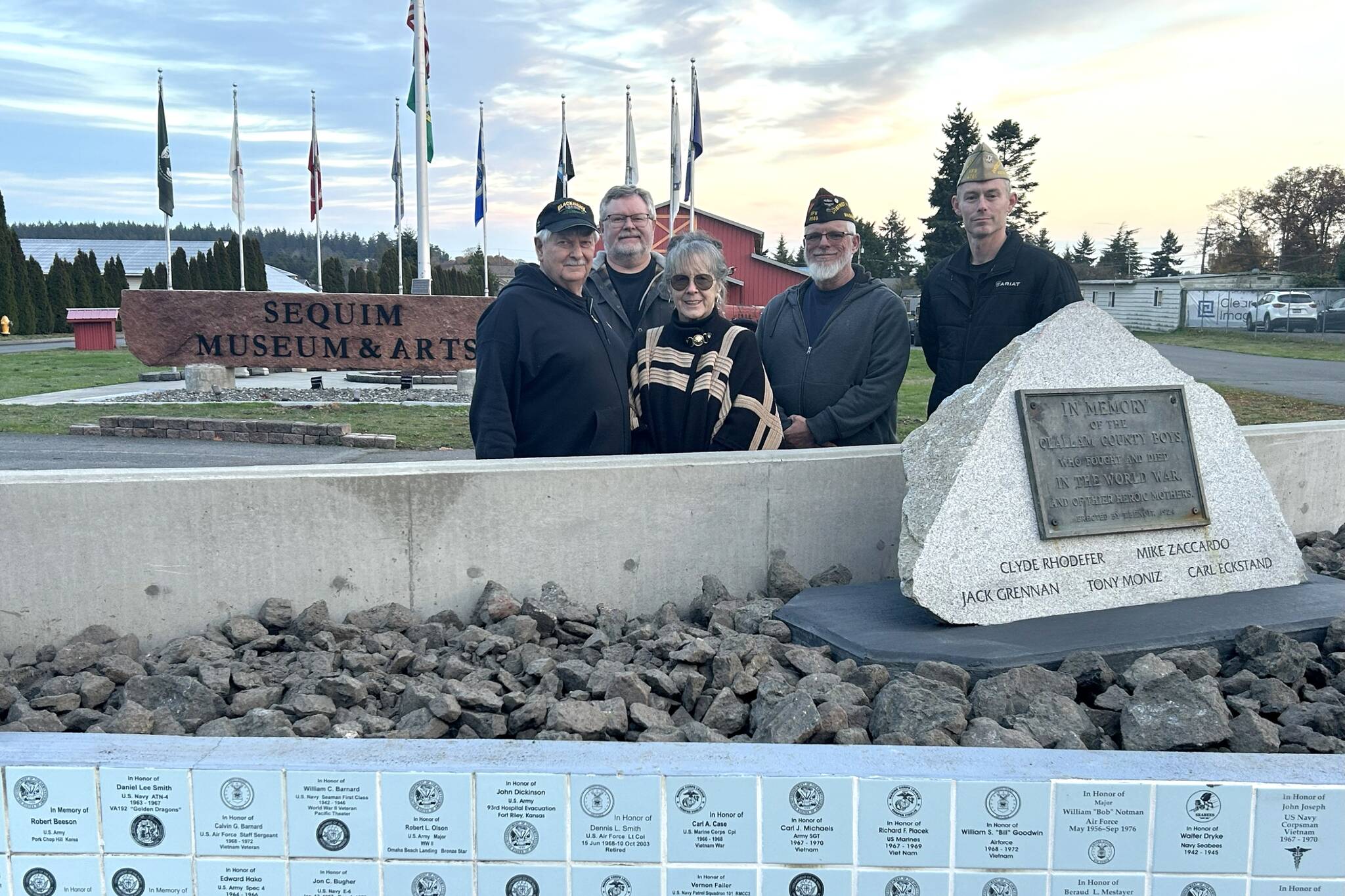 Sequim Museum volunteers Bob Stipe, Scott Stipe and executive director Judy Reandeau Stipe stand with Dan Bujok, VFW district commander, and Ken Bearly, Carlsborg 4760 post commander, at the museums Veterans Monument. Its recently been refurbished and organizers welcome past and present veterans and their family members to apply for a tile to be placed on the east side of the wall. (Matthew Nash/Olympic Peninsula News Group)