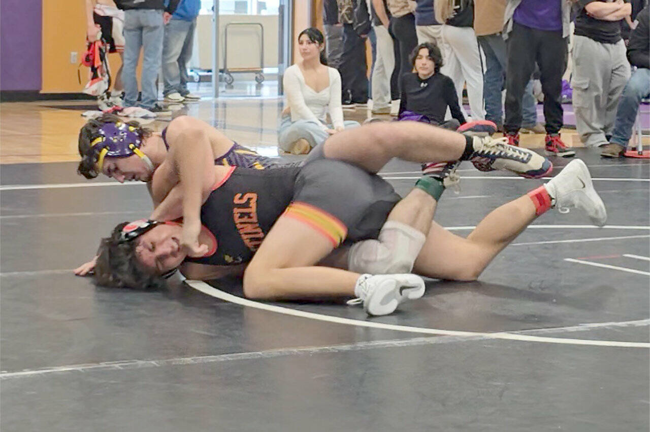 Sequim sophomore Aiden Glenn (on top) wrestles Anthony Martinez of Steilacoom at the Ramrock Invitational this weekend in Olympia. Glenn won two matches of the day, including a technical fall over Martinez, to finish fourth at 175 pounds. (Marcie Glenn)