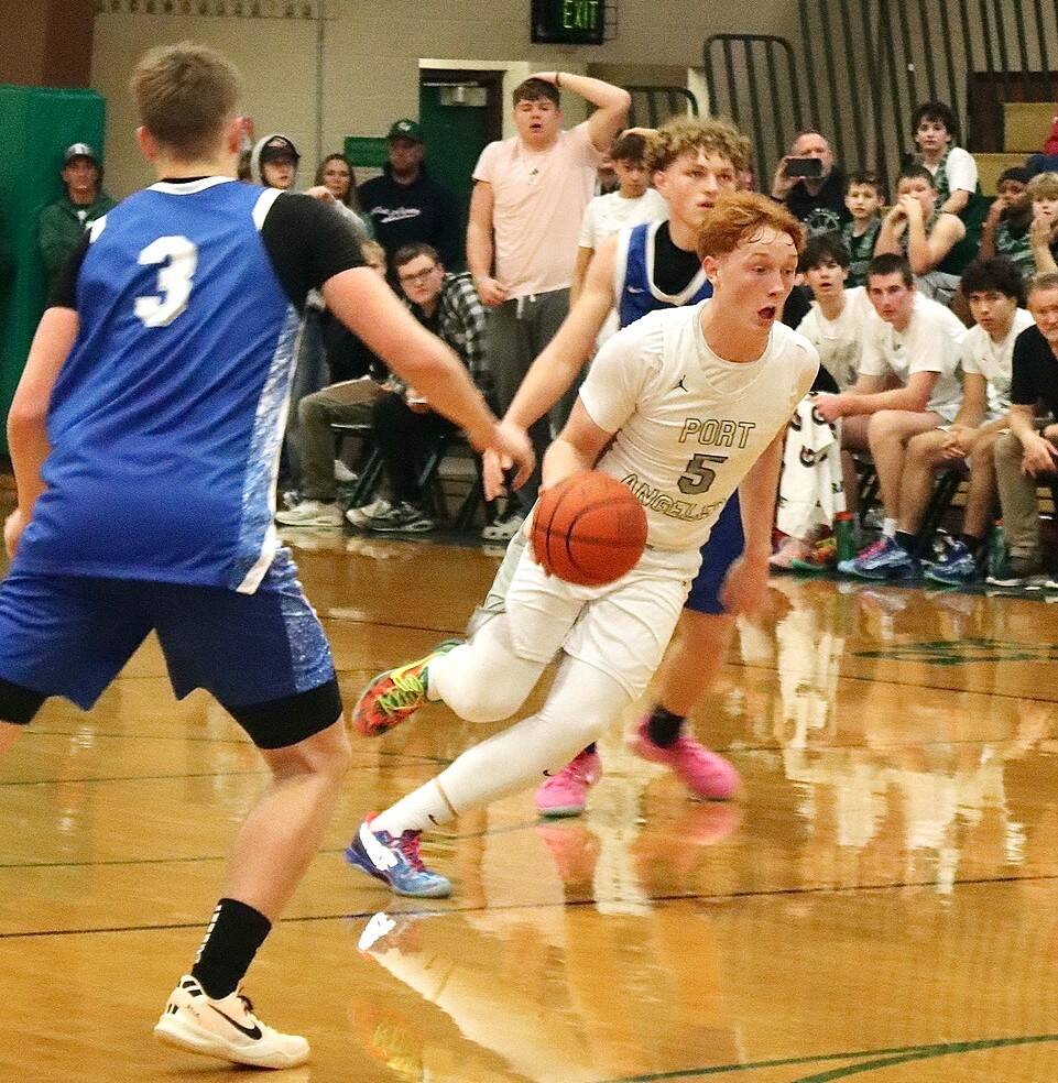 Daniel Benoit drives the ball up the court against Elma in Port Angeles first home game of the year Saturday. The Riders overcame an 18-0 Elma run to win in the fourth quarter 56-50. (Dave Logan/for Peninsula Daily News)