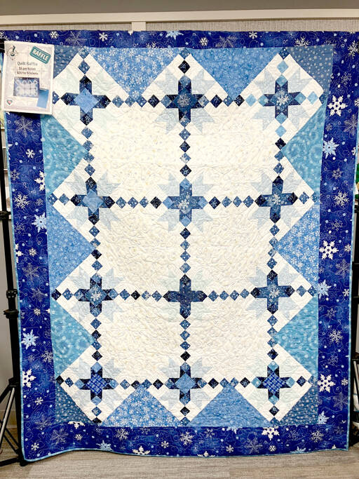 Snowflake, a handmade quilt by Nancy Foro, will be raffled to support Volunteer Hospice of Clallam County.