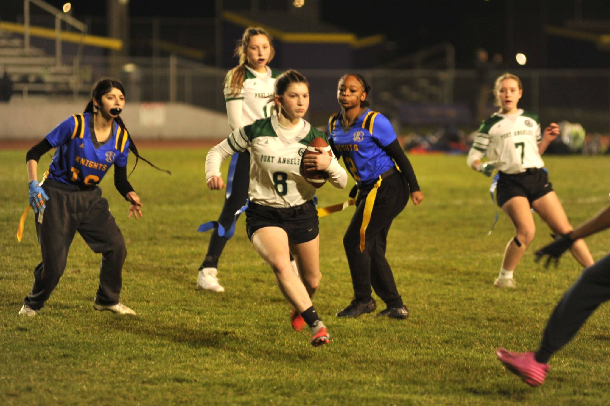 Port Angeles Miriam Cobb runs with the football during the Roughriders 35-14 win over Bremerton on Wednesday night at Sequim High School.
