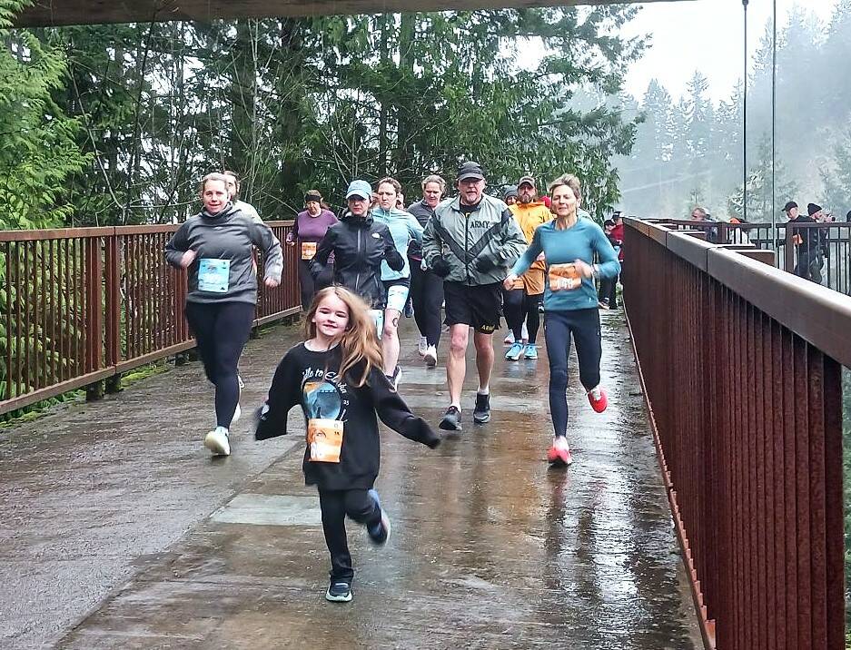 Olympic Peninsula News Group photo by Pierre LaBossiere/
Runners in the Run The Peninsulas Elwha Bridge Run take off into the rain Saturday morning.