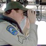 Steve Mullensky/for Peninsula Daily News                                Sgt. Kit Rosenberger of the state Department of Fish and Wildlife Police, scans the horizon whileOfficer Bryan Davidson pilots during a recent patrol of Marine Area 9 in Admiralty Inlet and theStrait of Juan de Fuca off Port Townsend.
