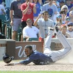 Seattle&rsquo;s Guillermo Heredia, (5) reacts after being tagged out by Chicago Cubs catcher Miguel Montero during a game last month. Heredia was sent down to Triple-A Tacoma in a move to boost the Mariners&rsquo; depleted pitching staff.