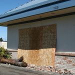 Damage is boarded up at the Port Angeles Taco Time after a vehicle crashed into the building early Sunday. (Rob Ollikainen/Peninsula Daily News)