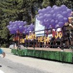 Darica Bertelson, 5, of Joyce shows elation as a float created by Joyce Bible Church passes by during the 33rd annual Joyce Daze and Wild Blackberry Festival grand parade last year. The festival also featured food, crafts, entertainment and, of course, blackberry pie. (Keith Thorpe/Peninsula Daily News)