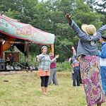 The audience enjoys a performance at a past Boomfest at the Dragon&rsquo;s Nest near Port Townsend. (David M. Lindsay)