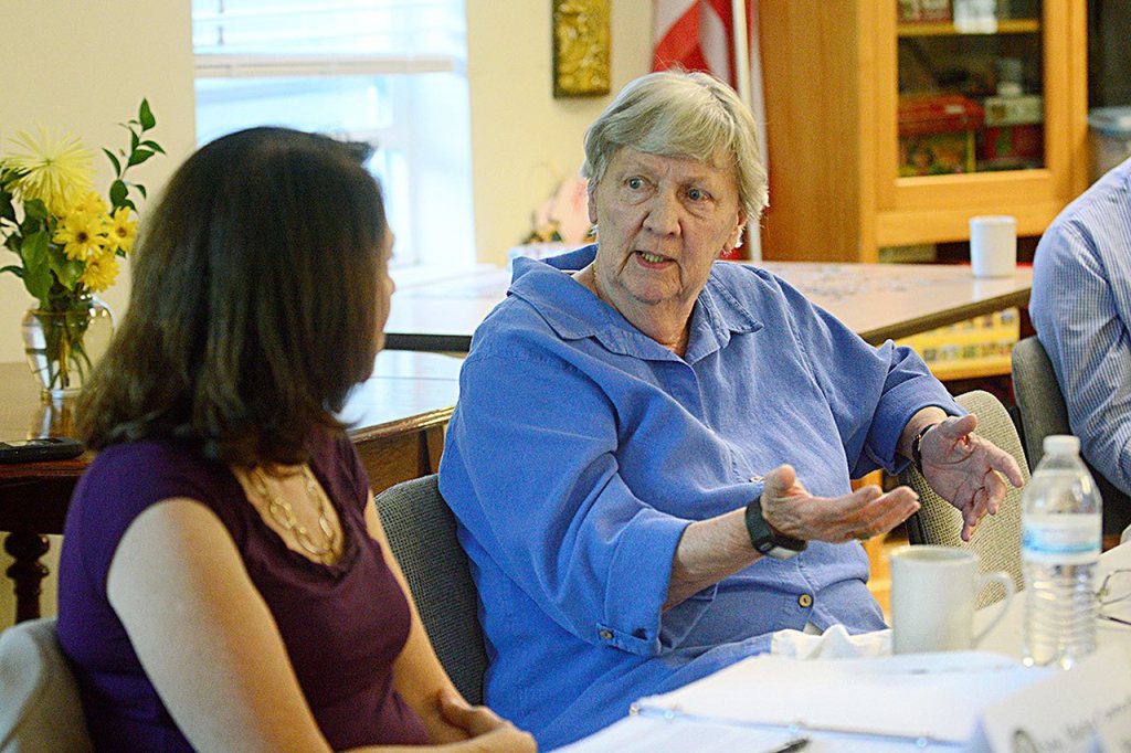 Sarah Hull, a resident at Discovery View Retirement Apartments in Port Townsend, tells U.S. Sen. Maria Cantwell, D-Mountlake Terrace, that with the lack of affordable housing on the North Olympic Peninsula, she was lucky to find a place to live in Port Townsend. (Jesse Major/Peninsula Daily News)