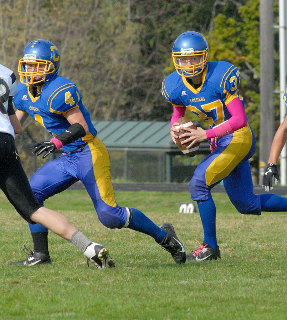 Keith Thorpe/Peninsula Daily News                                Crescent&rsquo;s Eric Emery, left, blocks for quarterback KC Spencer during a game against Clallam Bay last season.